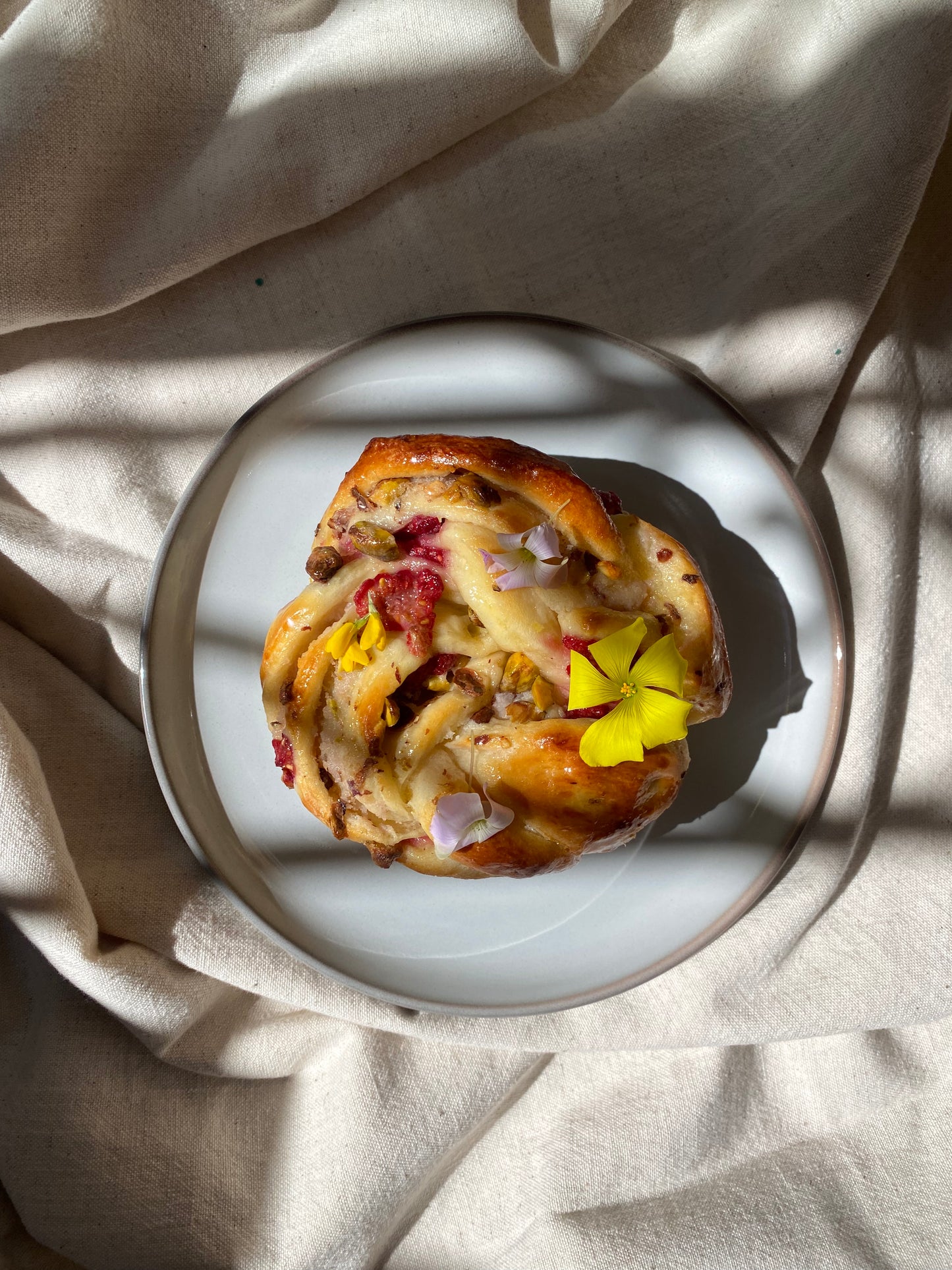 Raspberry & pistachio babka roll